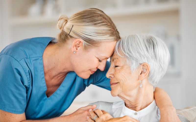 nurse caring senior woman home
