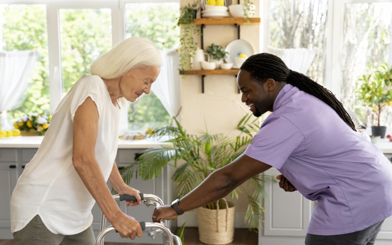 male social worker taking care old woman